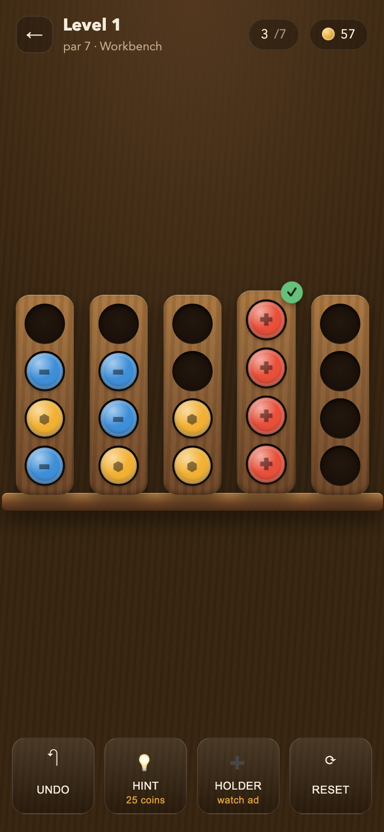 A Screw Sort board mid-solve: five wooden holders with blue, gold and red screws, one holder completed and ticked